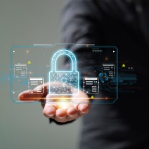 A hand holds up a secure lock
