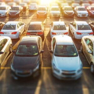 a parking lot full of cars at a dealership