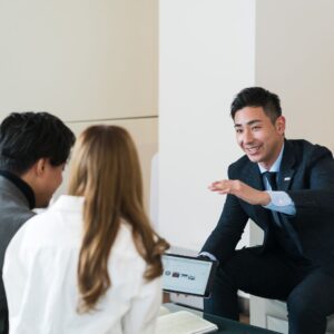 people discussing purchasing a car