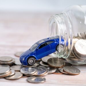 car shown alongside coins 