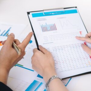 people review financial data on a spreadsheet